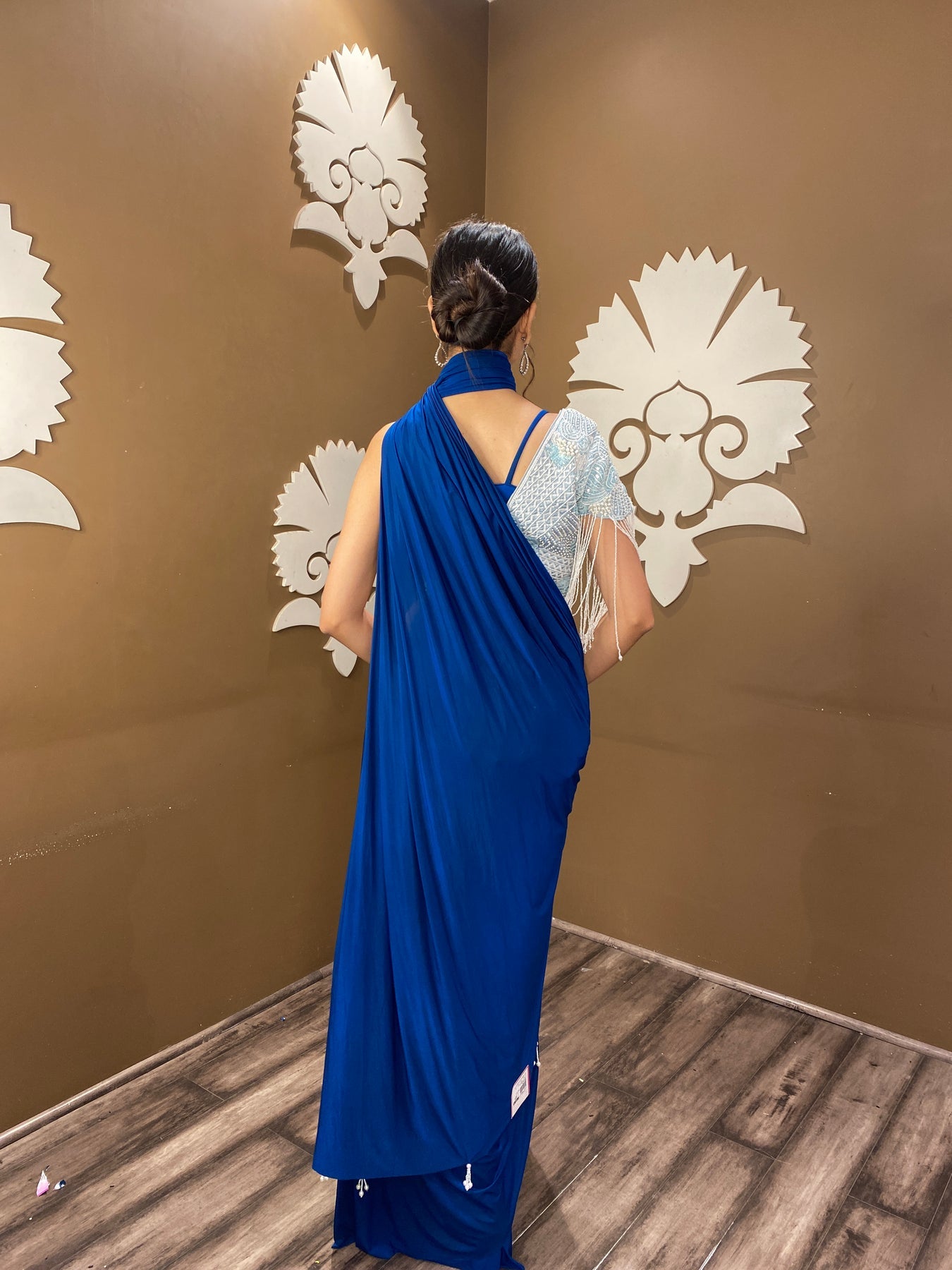 Trendy blue color floral motif embroidered drape saree