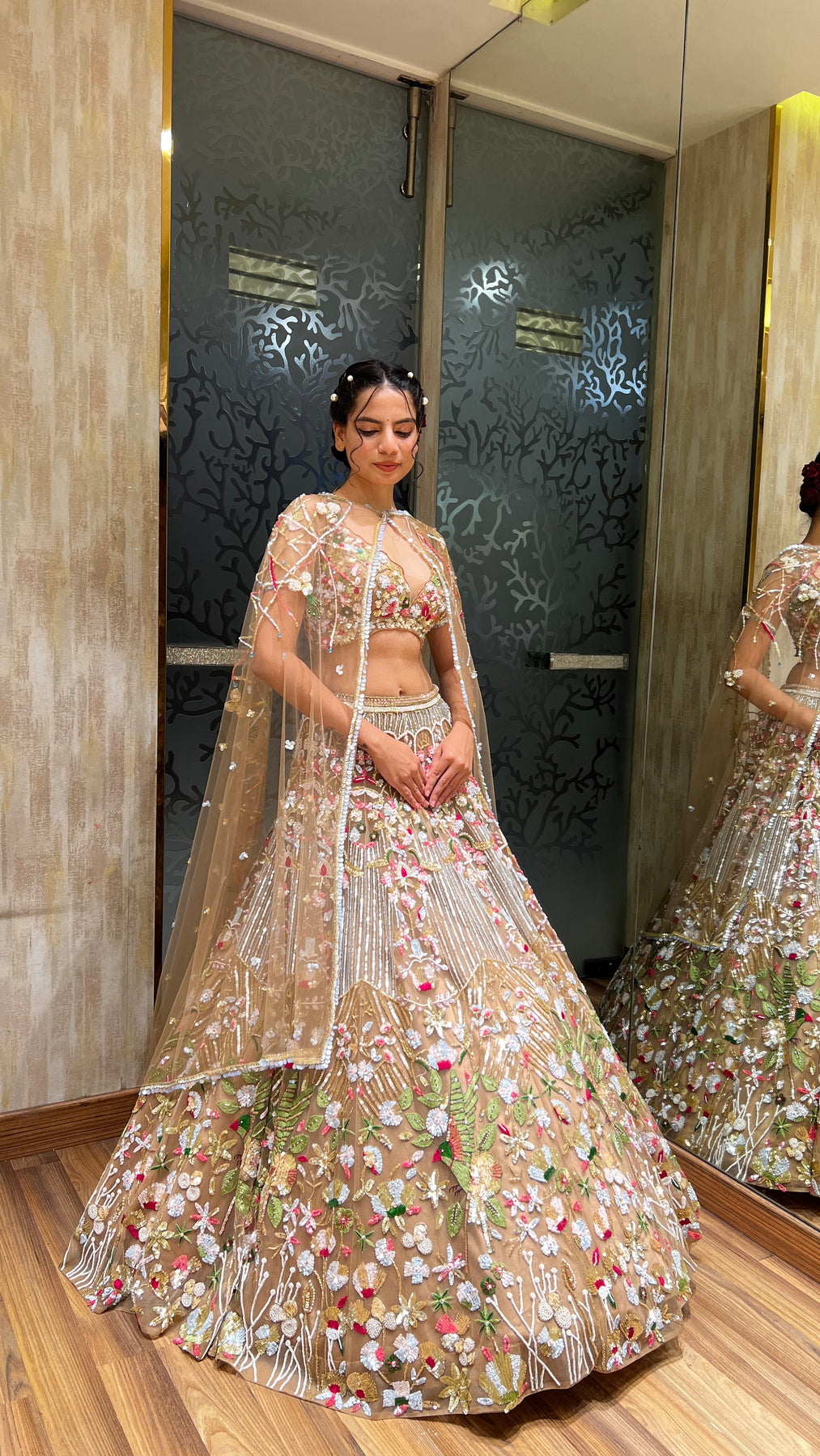 Glamorous dark peach color floral motif hand embroidered lehanga