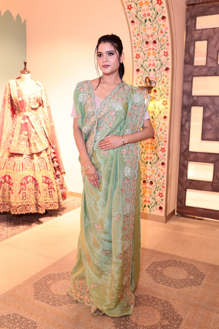 Exquisite Pale Green Lama Georgette Saree with Delicate Embroidery