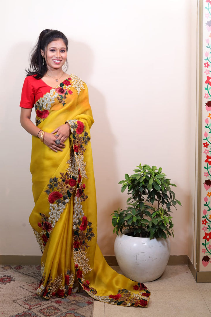 Luxurious Yellow Glass Tissue Saree with Intricate Floral Embroidery
