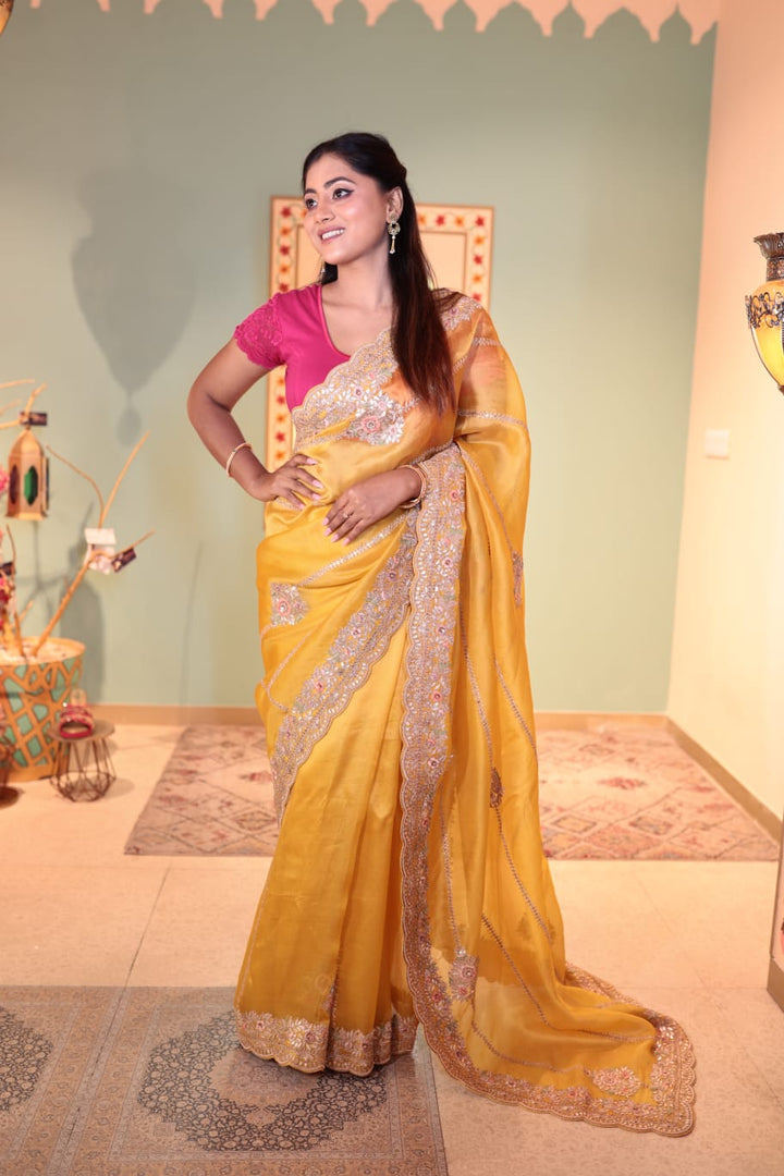 Exquisite Yellow Organza Saree with Embellished Border