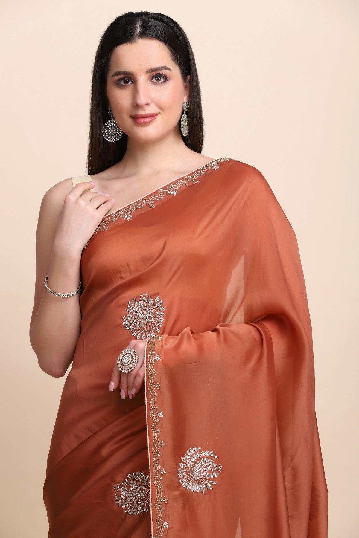 Elegant rusty orange color peacock motif embroidered saree