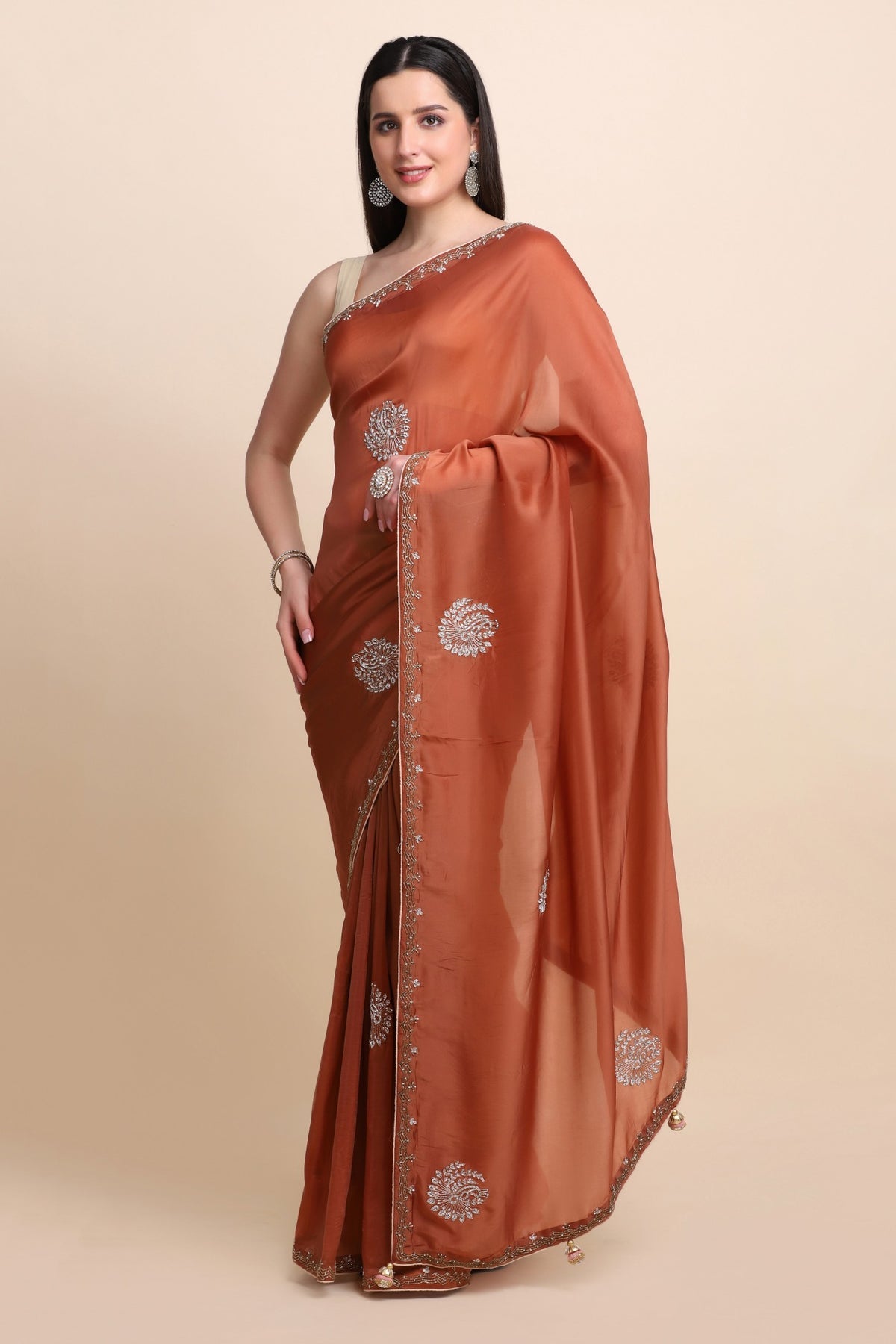 Elegant rusty orange color peacock motif embroidered saree