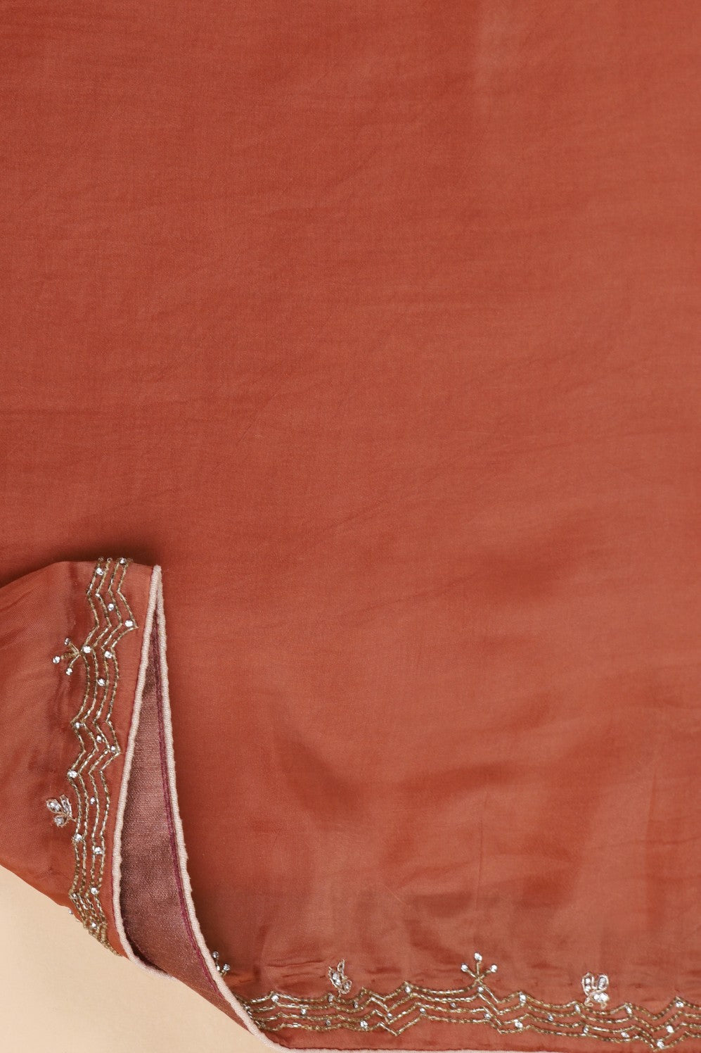 Elegant rusty orange color peacock motif embroidered saree