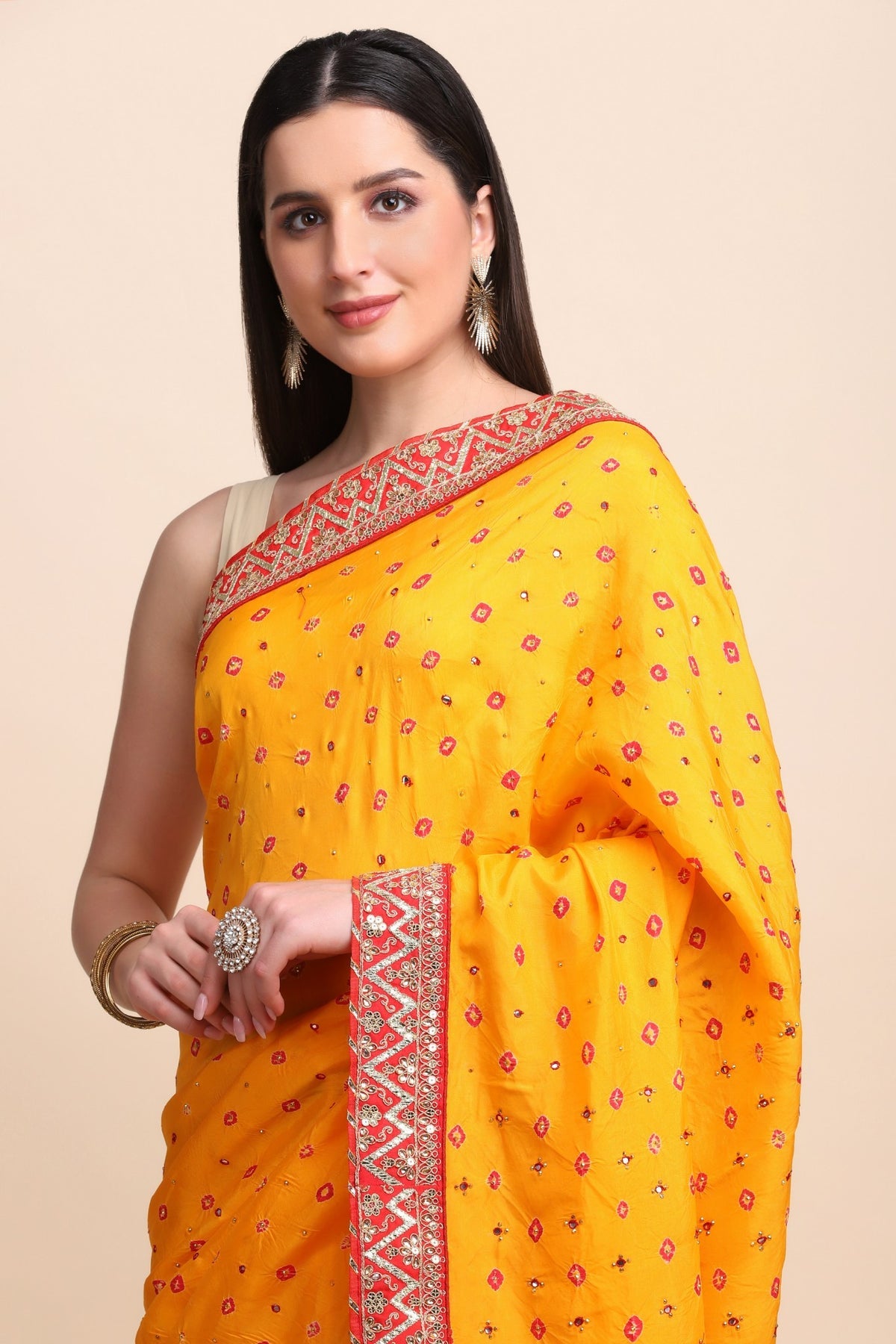 Beautiful yellow color tie & dye bandhini effect saree paired with matching blouse