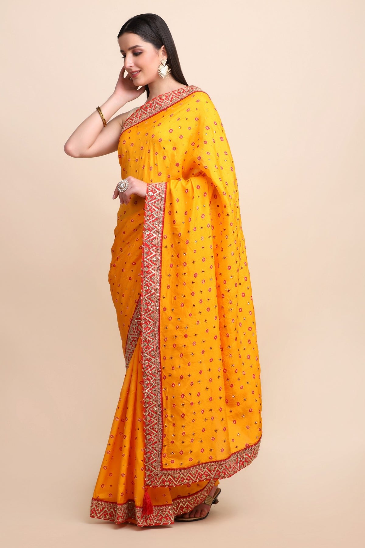 Beautiful yellow color tie & dye bandhini effect saree paired with matching blouse