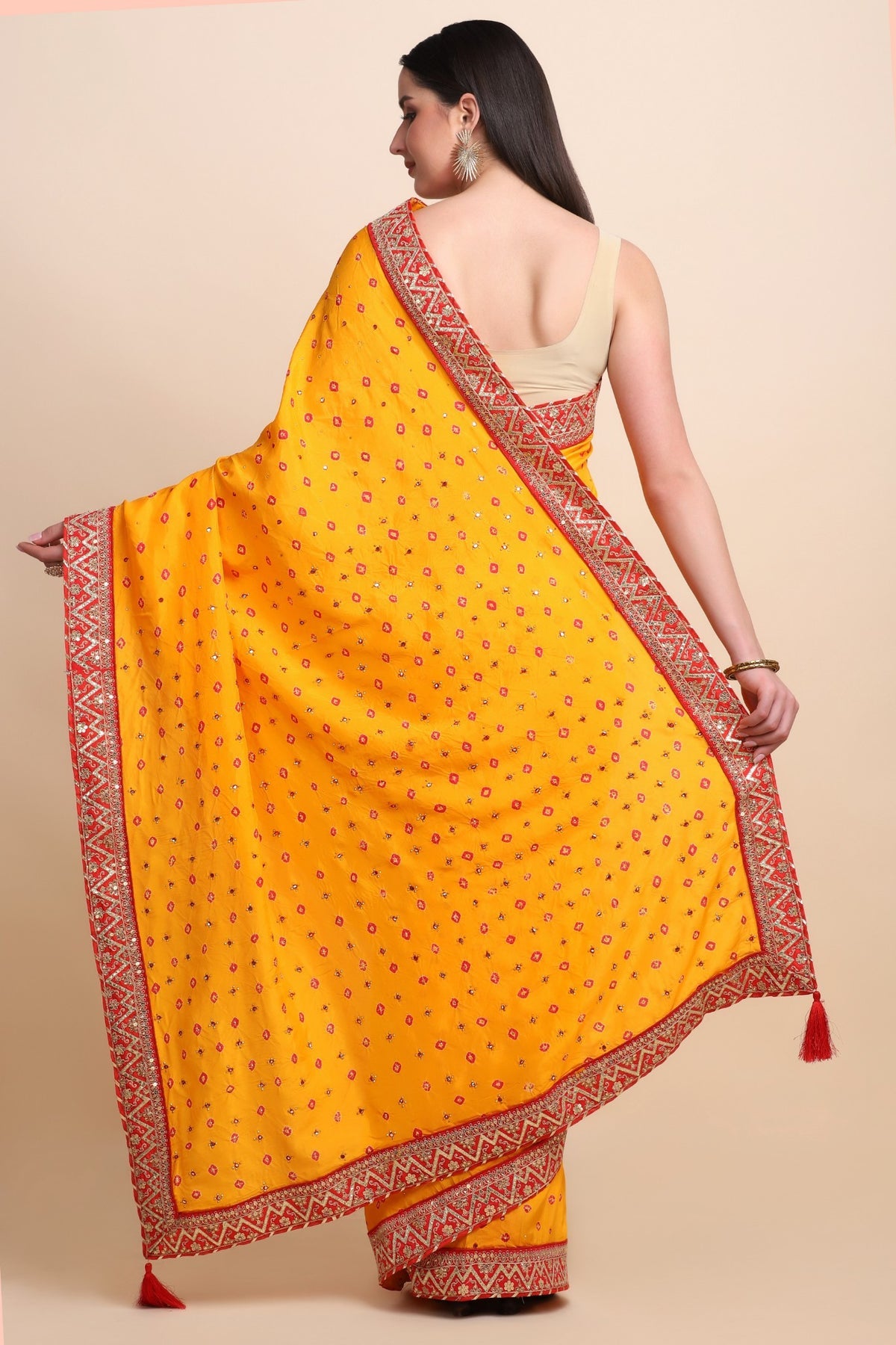Beautiful yellow color tie & dye bandhini effect saree paired with matching blouse