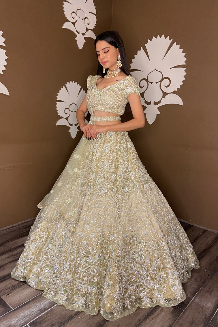 Beautiful light yellow color floral and textured pattern hand embroidered bridal lehanga