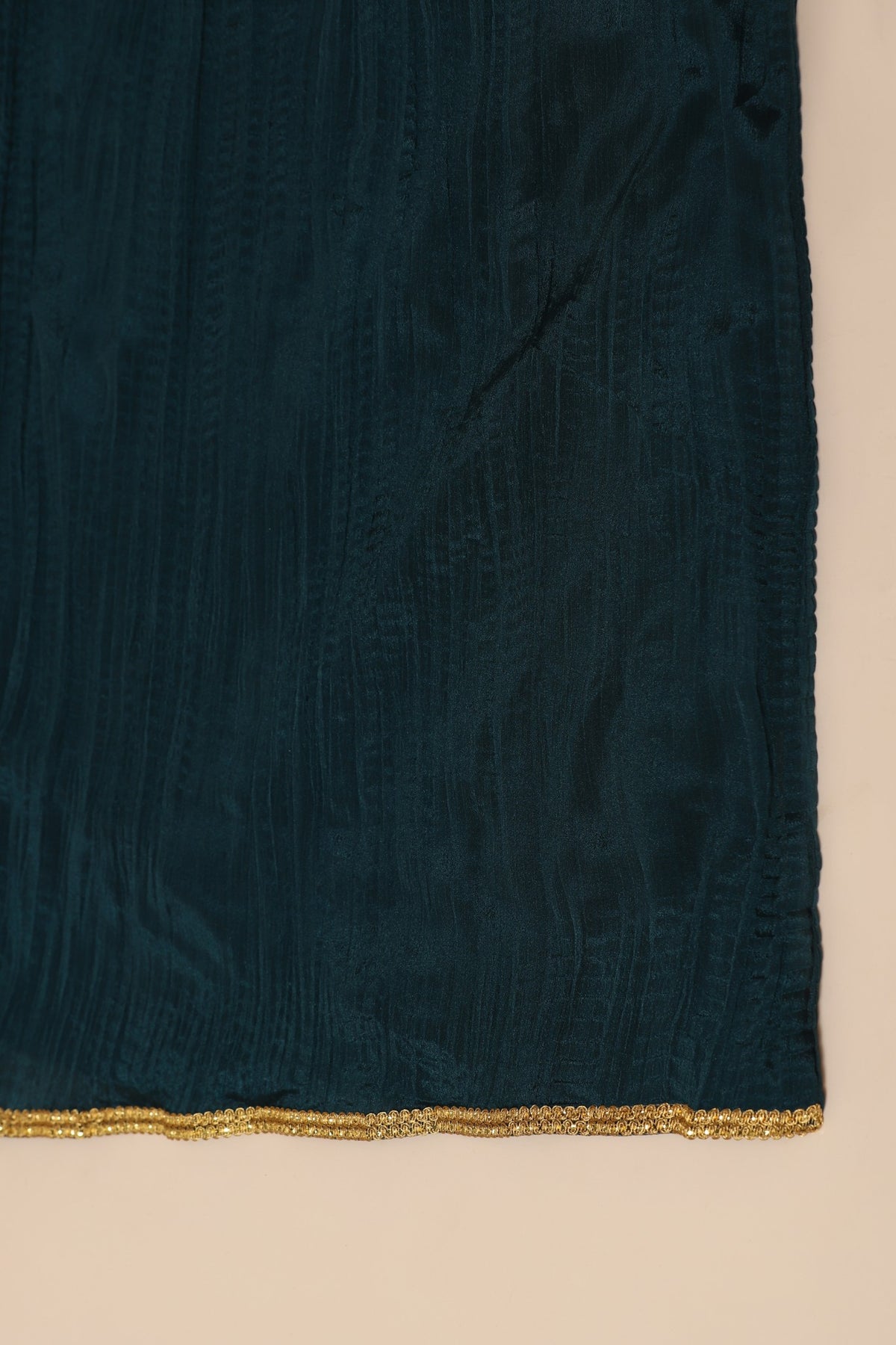 Red patola suit with embroidery on neckline paired with peacock blue pants and peacock blue dupatta