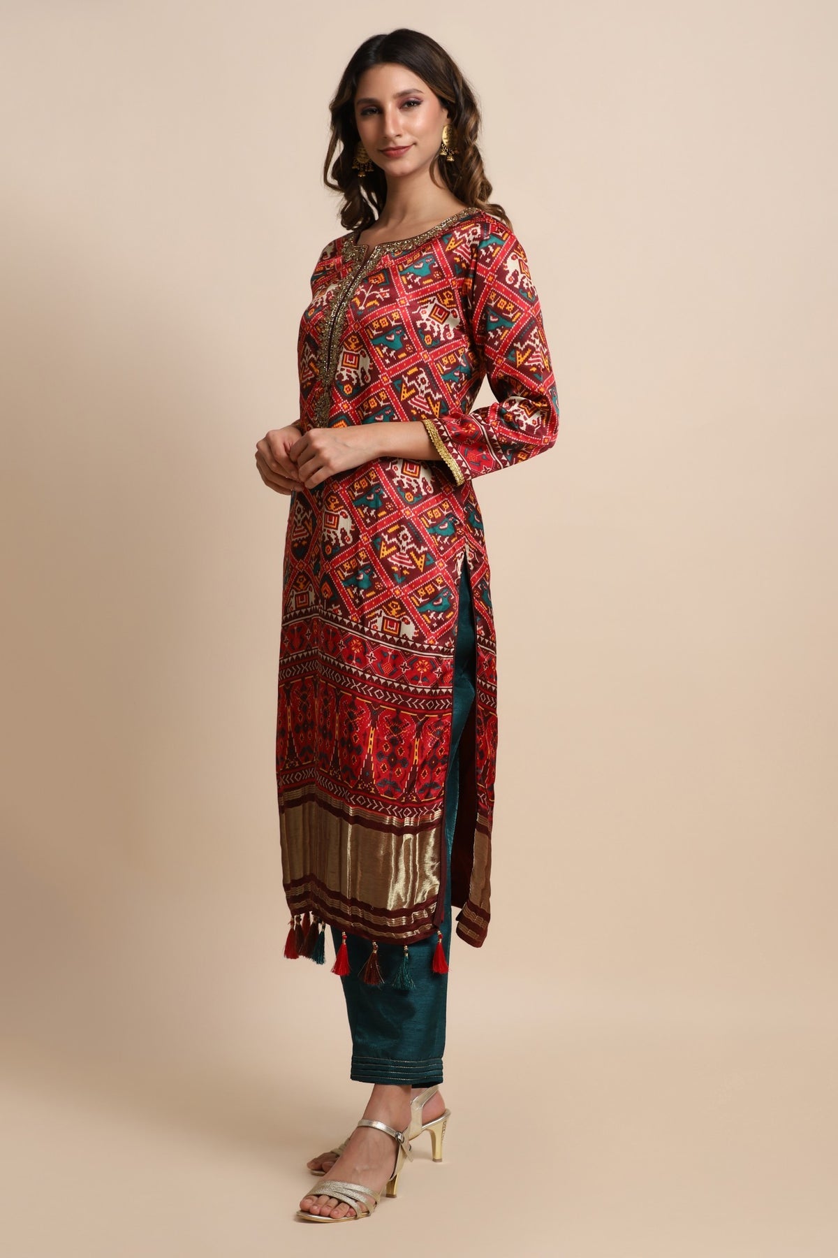 Red patola suit with embroidery on neckline paired with peacock blue pants and peacock blue dupatta