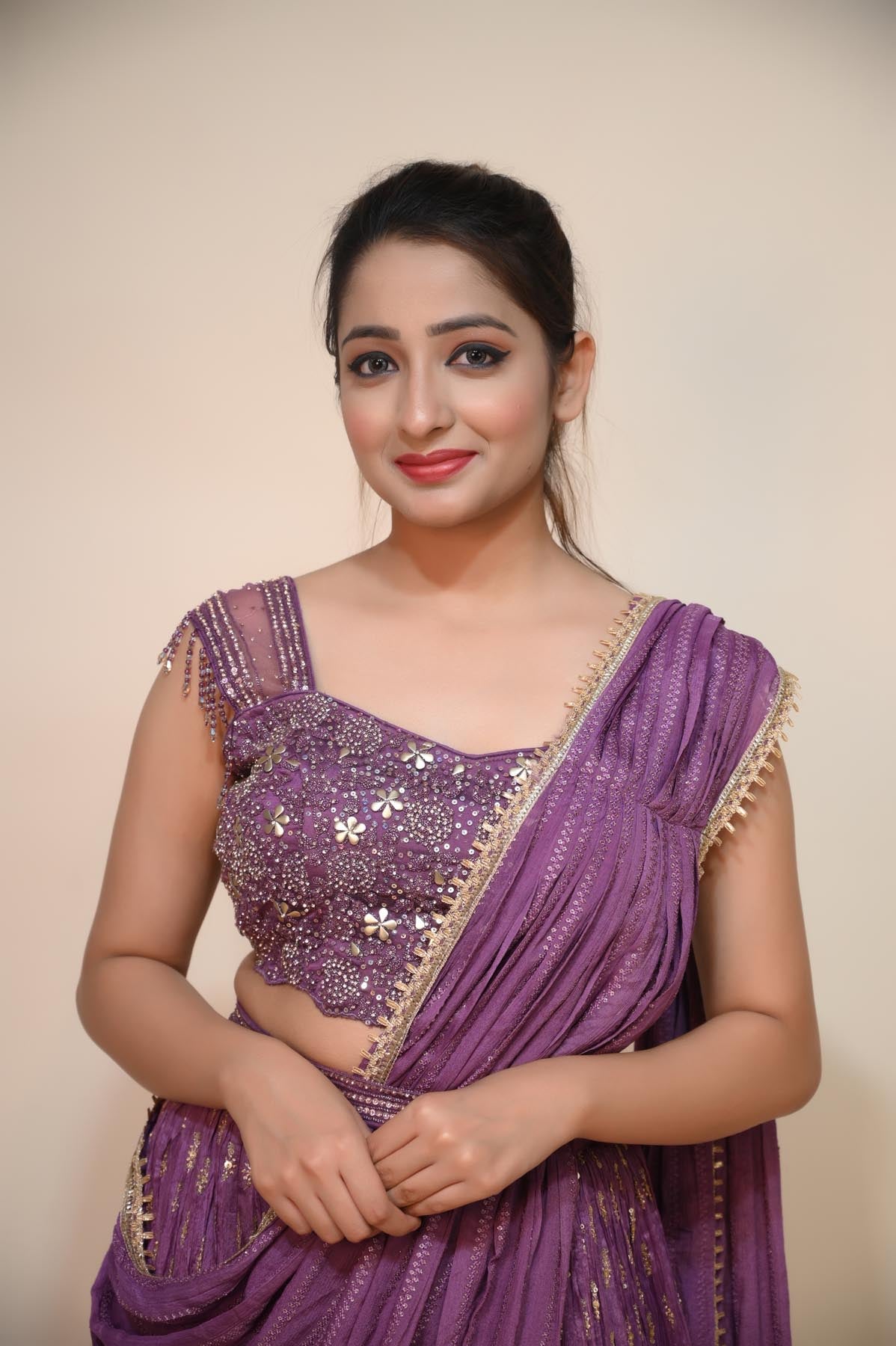 Elegant Purple Net Saree with Stone, Sequins, and Lace Embellishments