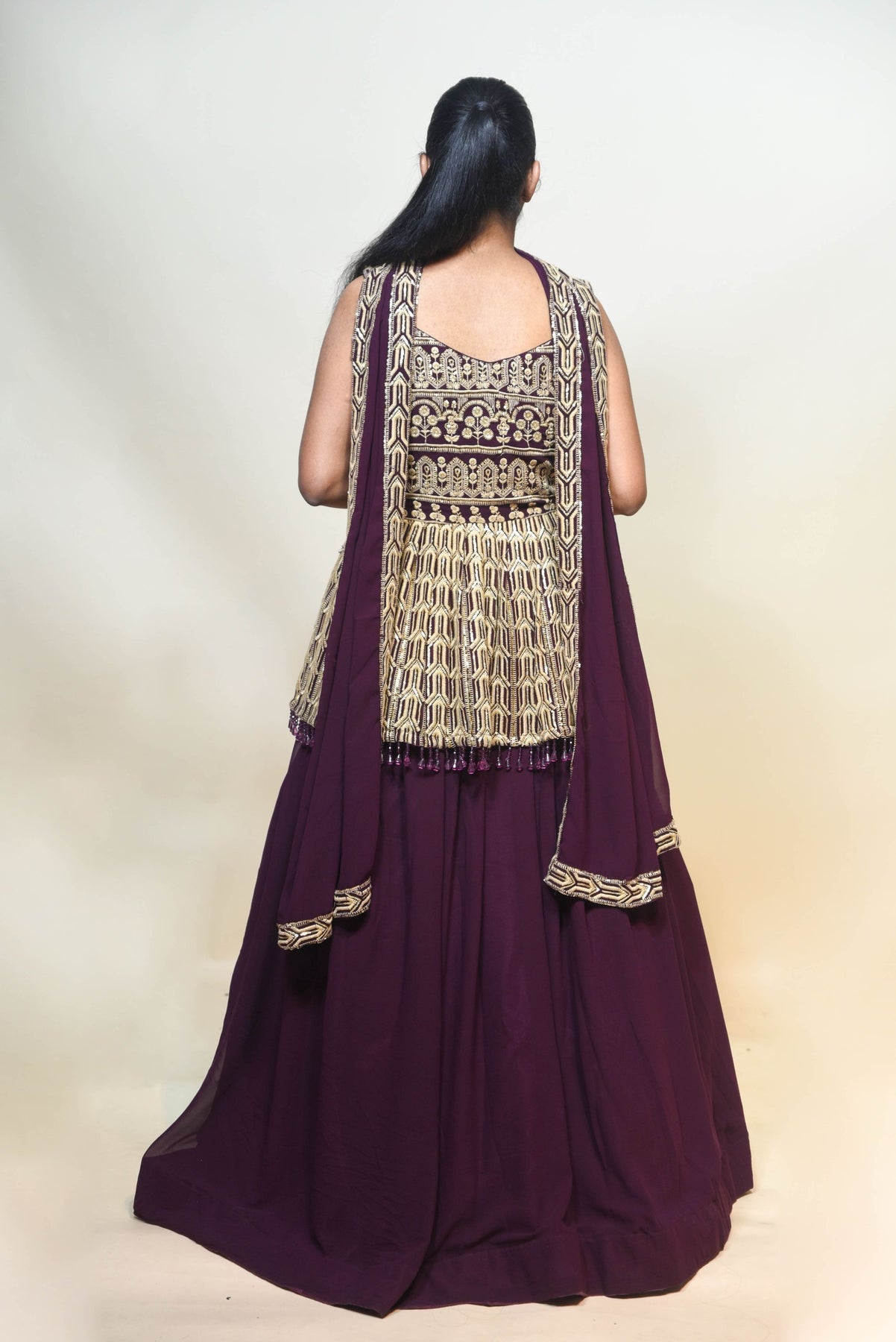 classic wine color floral motif peplum top and lehenga set
