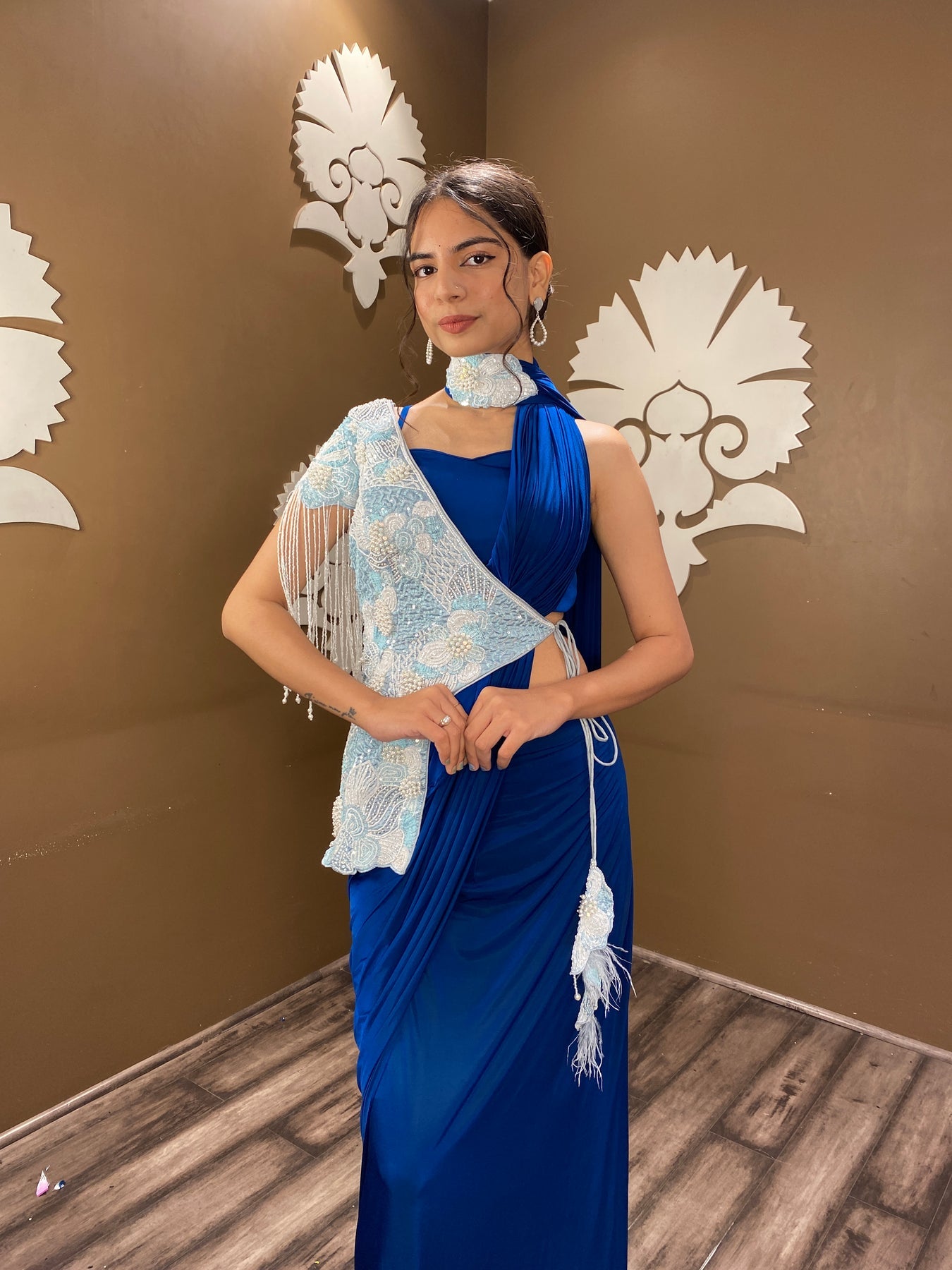 Trendy blue color floral motif embroidered drape saree