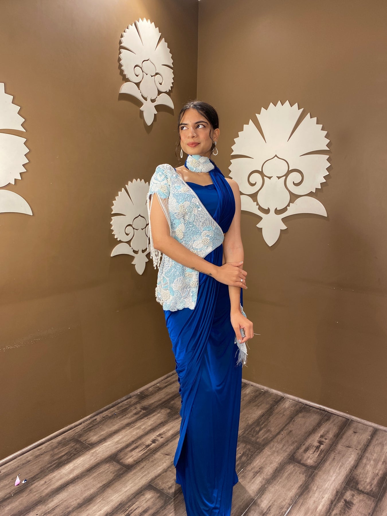 Trendy blue color floral motif embroidered drape saree