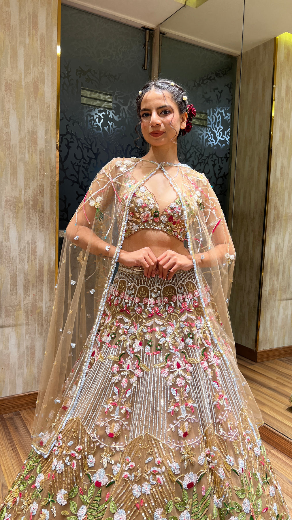 Glamorous dark peach color floral motif hand embroidered lehanga