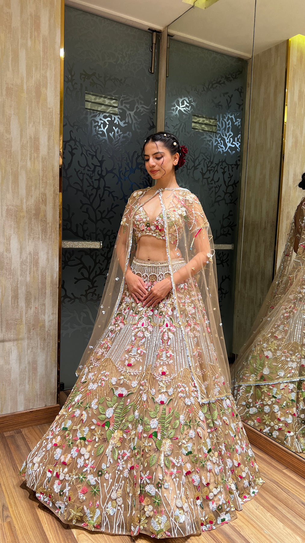 Glamorous dark peach color floral motif hand embroidered lehanga