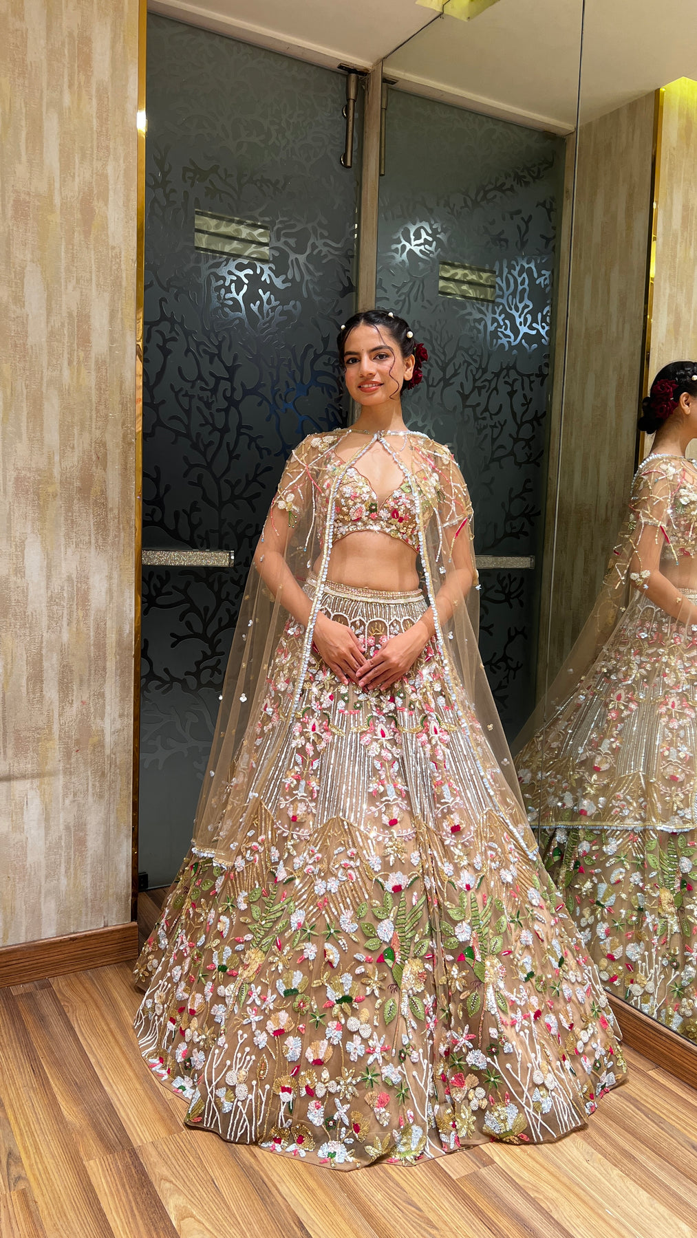 Glamorous dark peach color floral motif hand embroidered lehanga