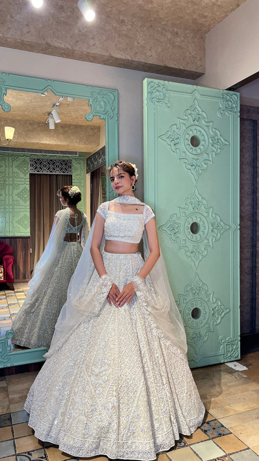 elegant white color floral motif embroidered lehenga