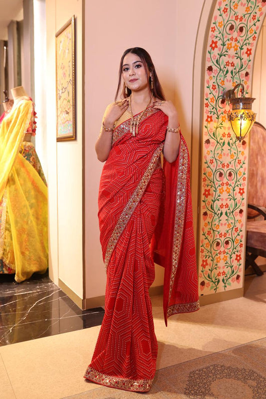 Glamorous Red Bandhani Saree with Intricate Mirror Work and Embroidery