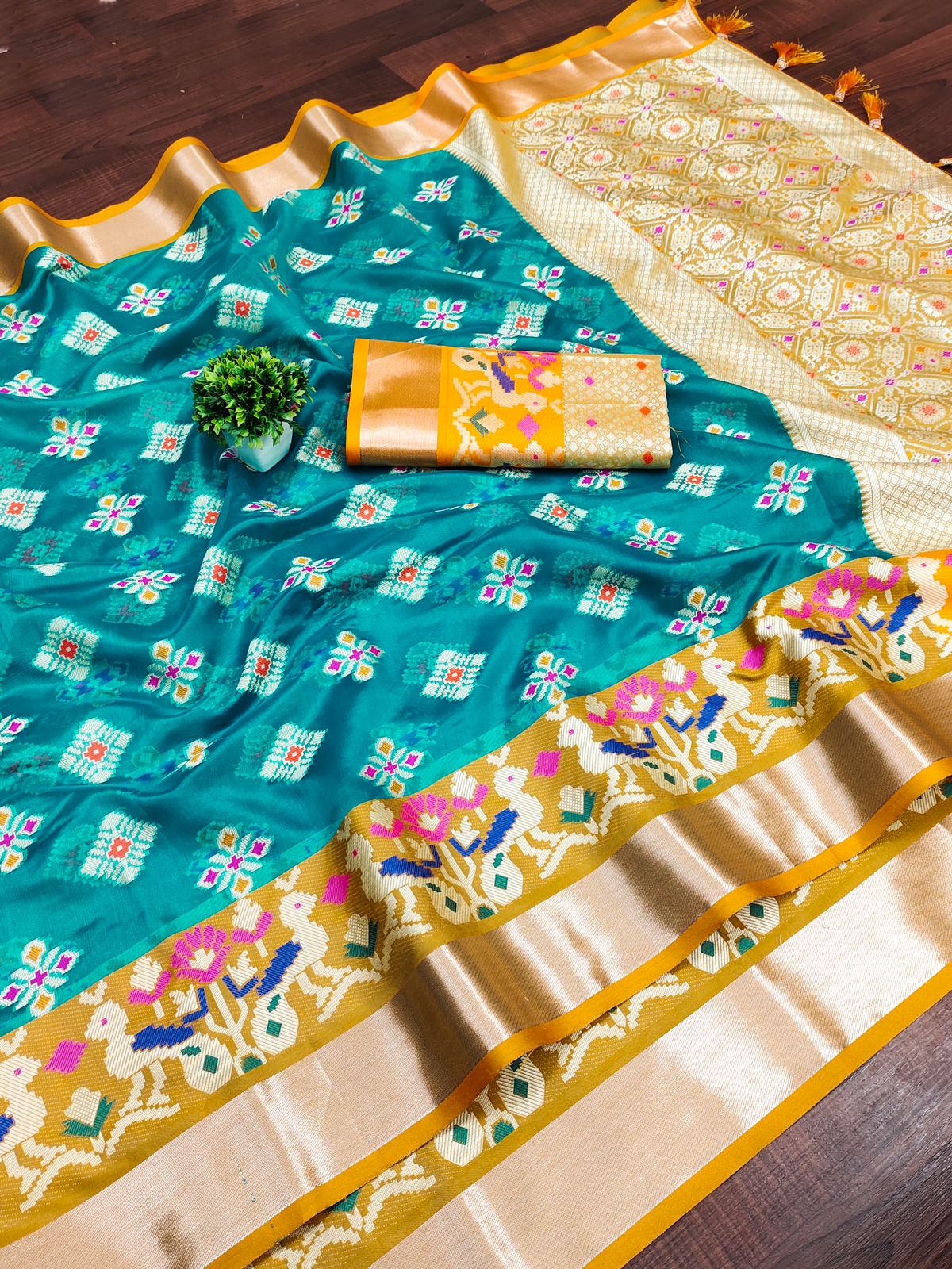 Engaging Firozi Organza Silk Saree With Tempting Blouse Piece