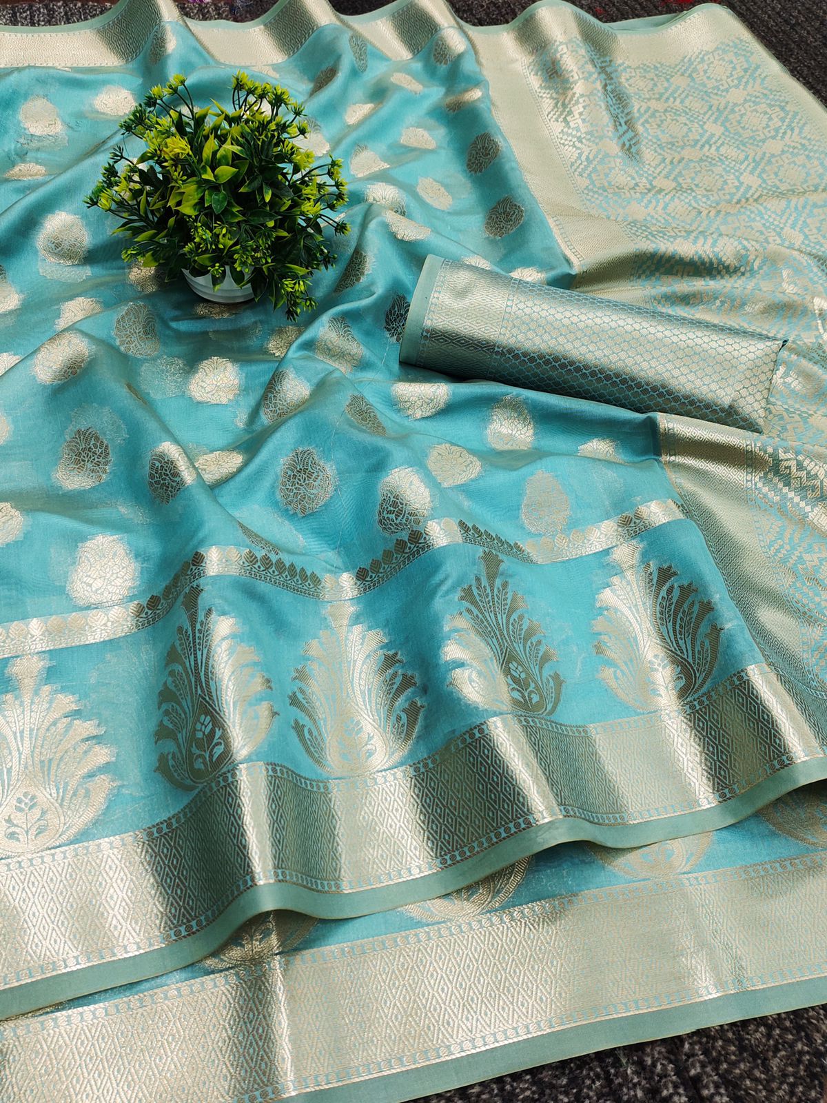 Snappy Firozi Organza Silk Saree With Comely Blouse Piece