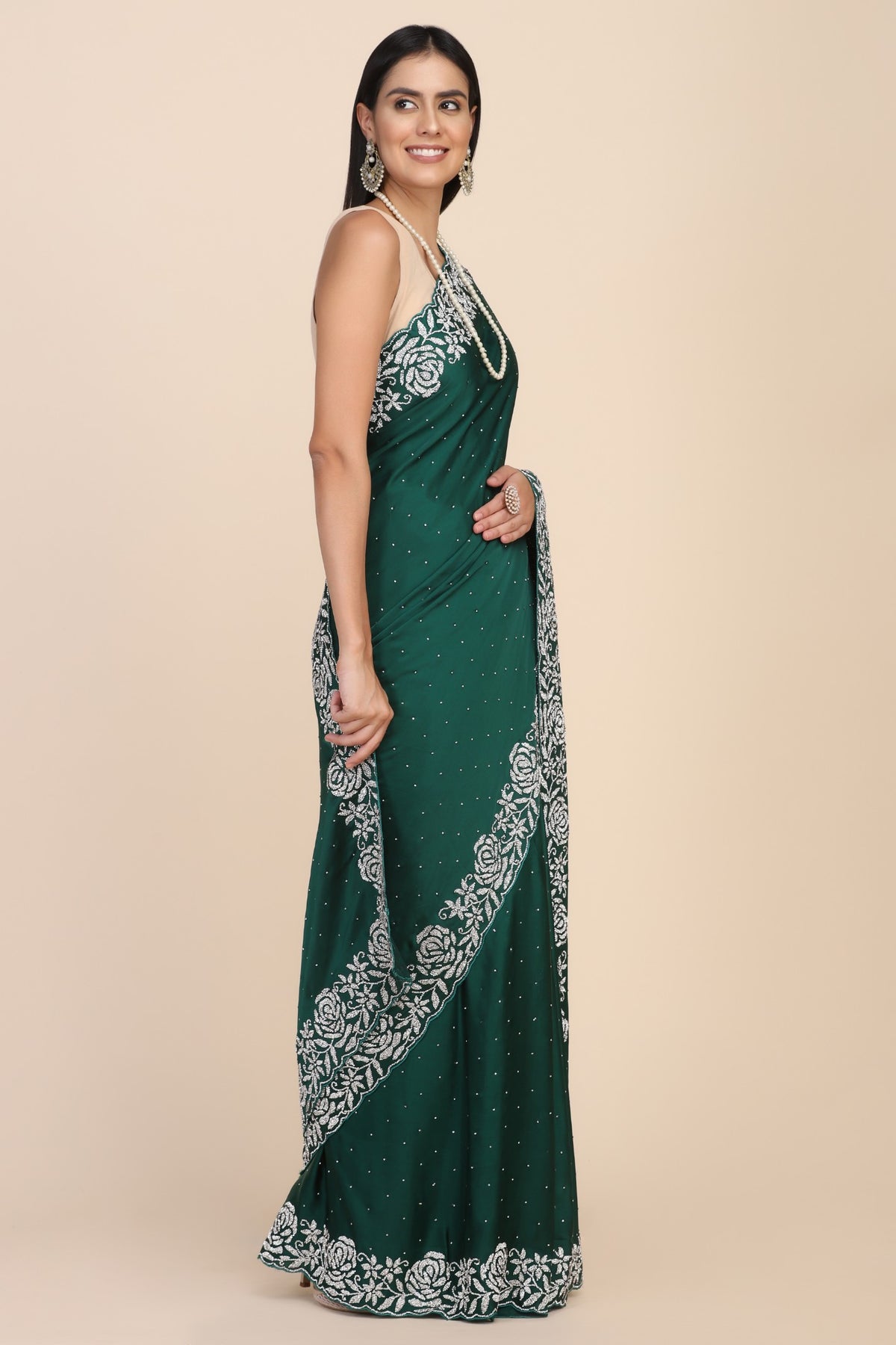 Elegant dark green color floral motif embroidered saree