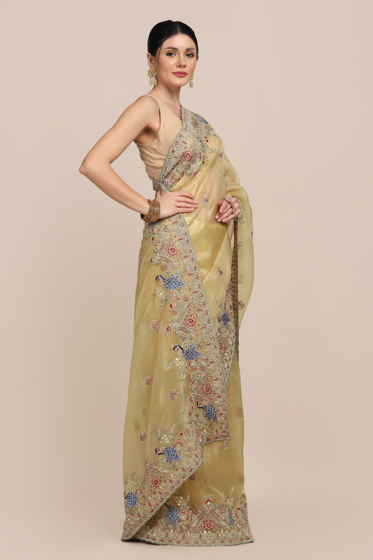 Elegant yellow color peacock motif embroidered saree
