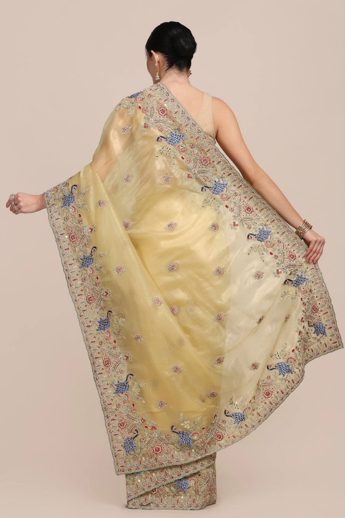 Elegant yellow color peacock motif embroidered saree