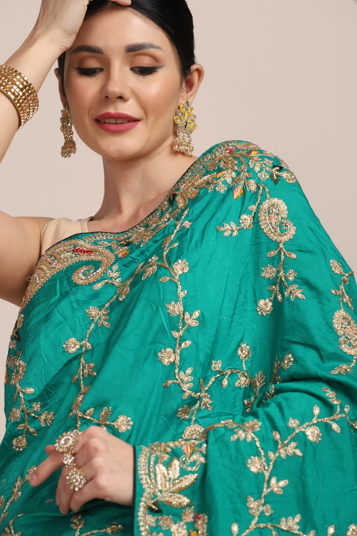 Beautiful peacock green color paisley motif embroidered saree
