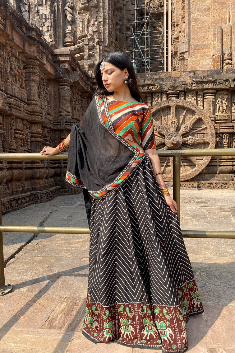 Beautiful chevron stripes printed having patola motif border lehanga with multi colored stripes blouse and matching dupatta