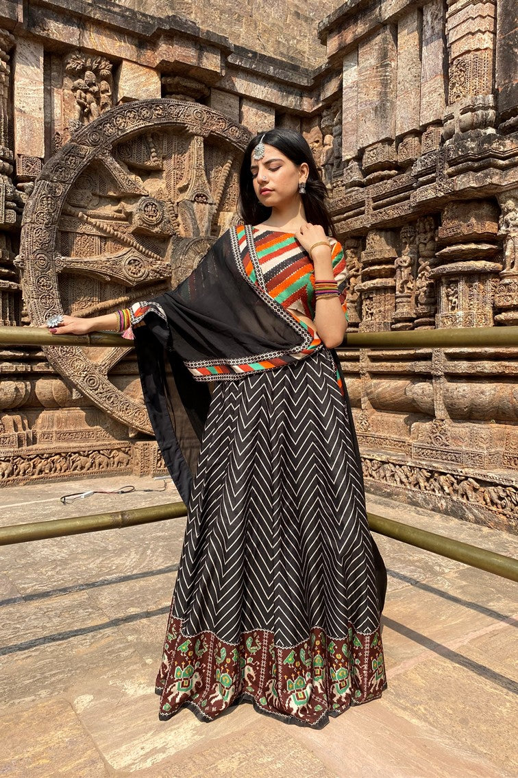 Beautiful chevron stripes printed having patola motif border lehanga with multi colored stripes blouse and matching dupatta