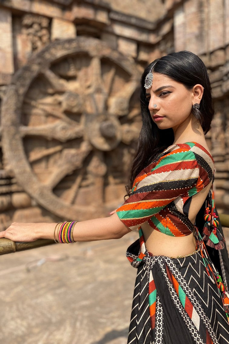 Beautiful chevron stripes printed having patola motif border lehanga with multi colored stripes blouse and matching dupatta