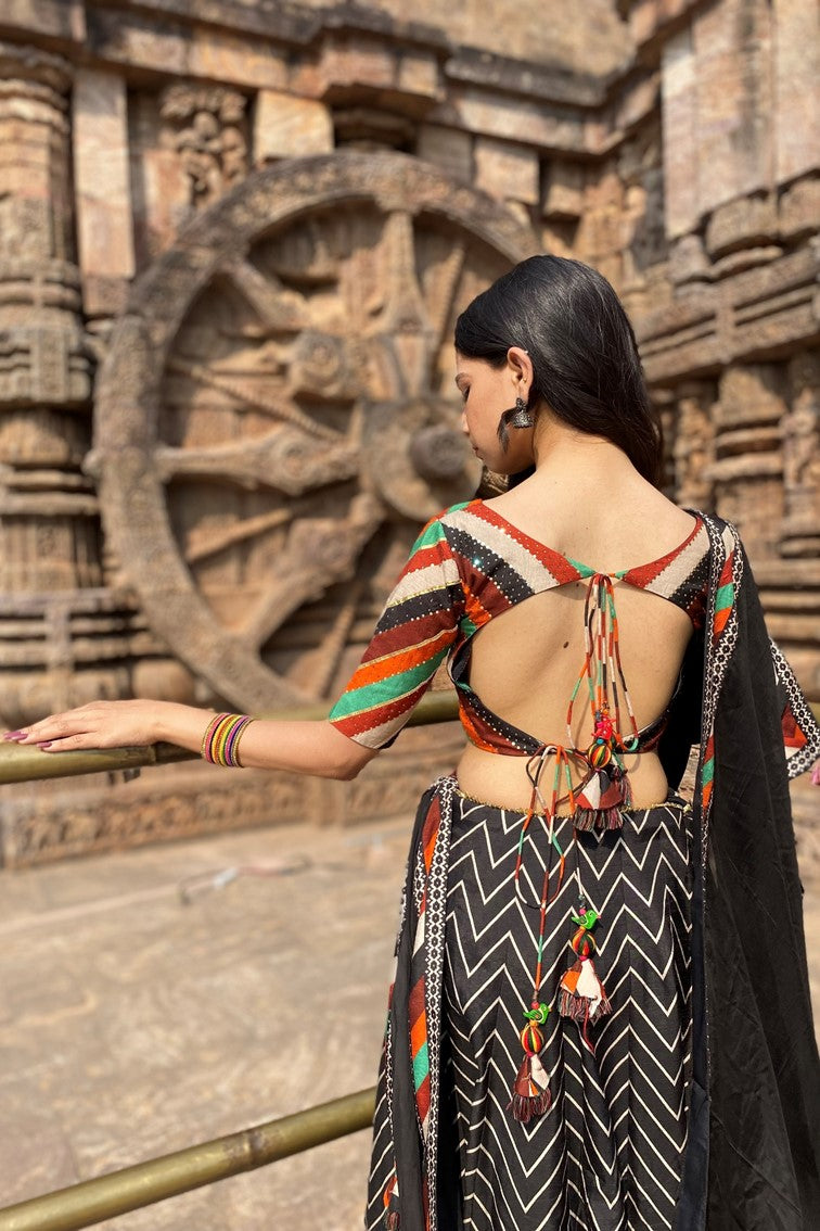 Beautiful chevron stripes printed having patola motif border lehanga with multi colored stripes blouse and matching dupatta