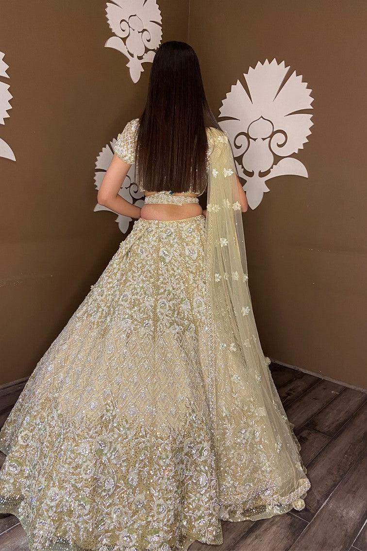 Beautiful light yellow color floral and textured pattern hand embroidered bridal lehanga