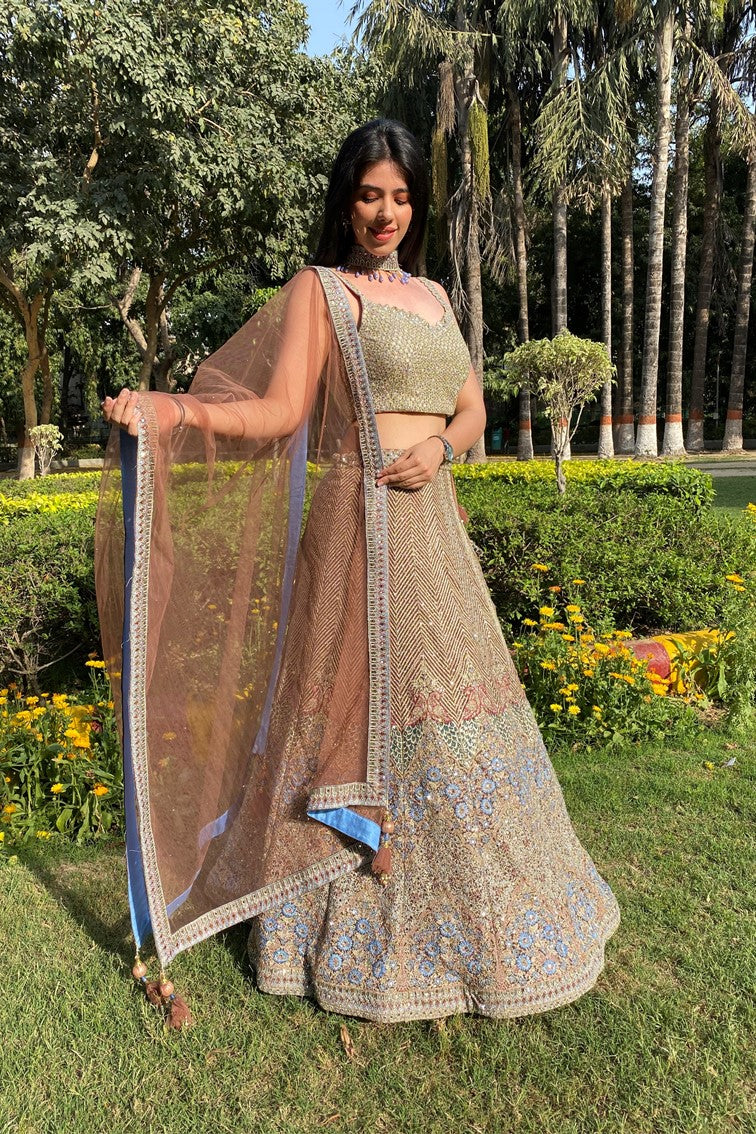 Glamorous golden color floral and geometrical motif embroidered lehanga set