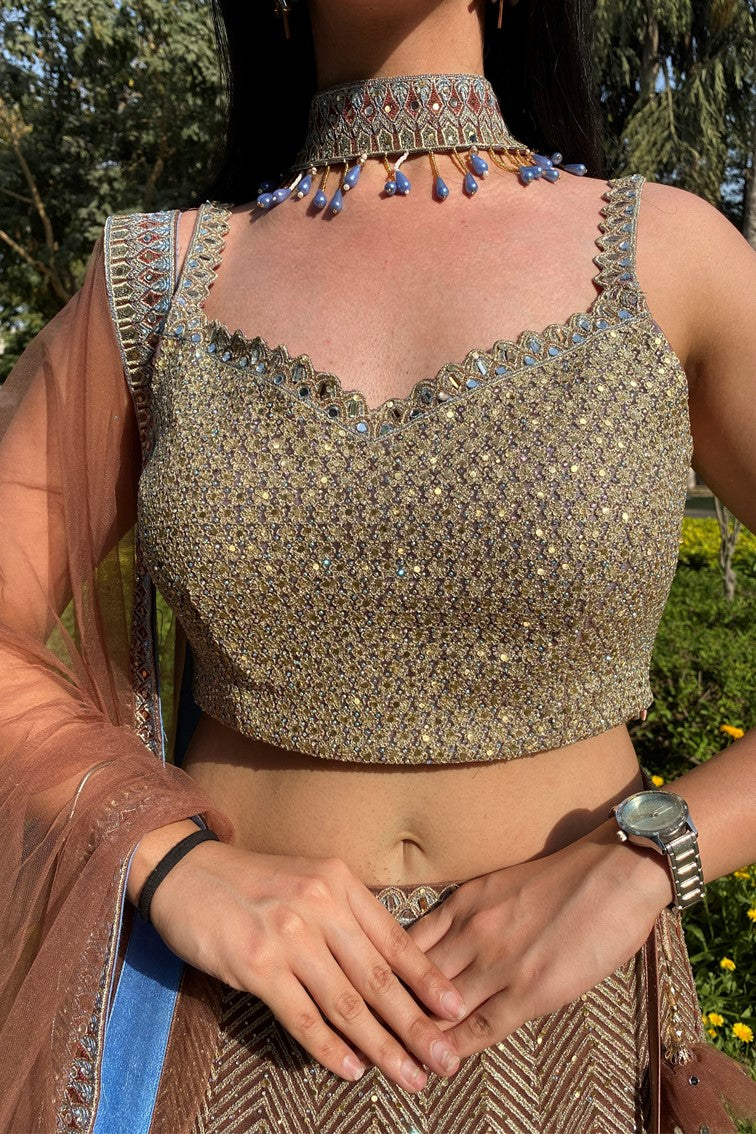 Glamorous golden color floral and geometrical motif embroidered lehanga set