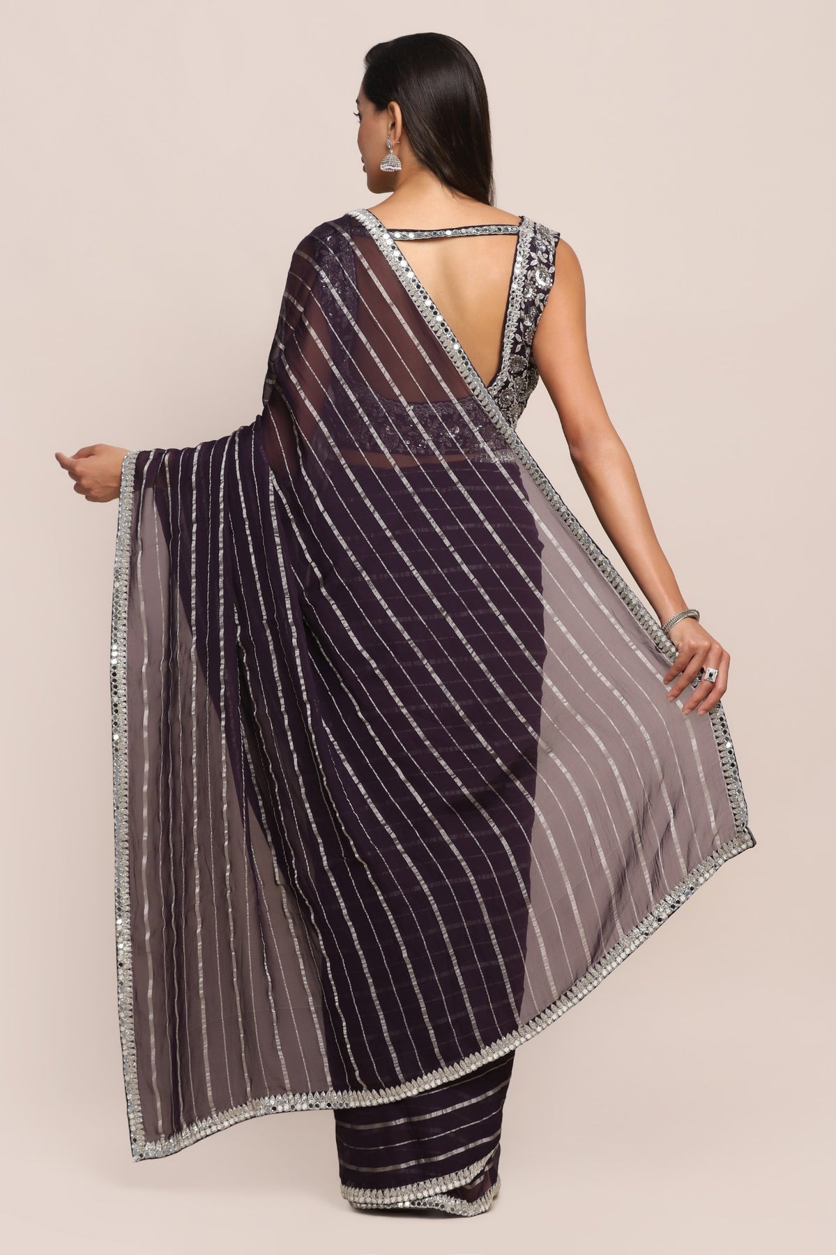 Elegant purple color floral motif embroidered saree