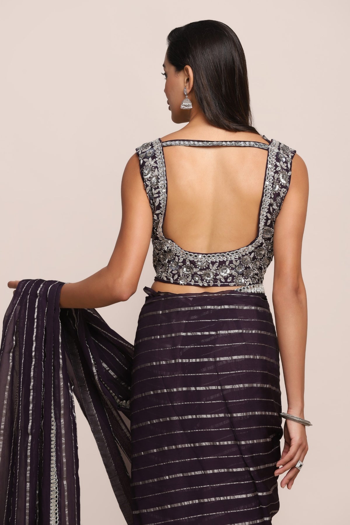 Elegant purple color floral motif embroidered saree