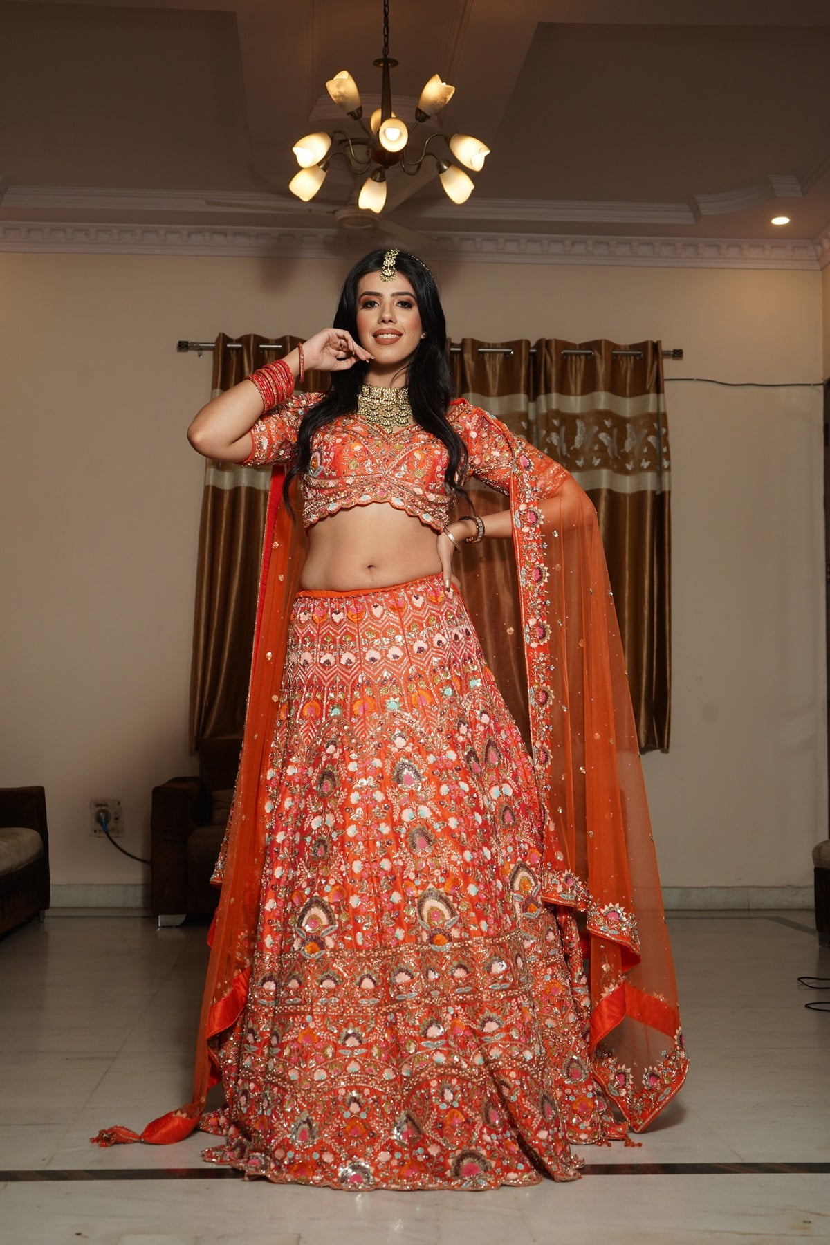 Classy orange color floral motif hand embroidered lehanga