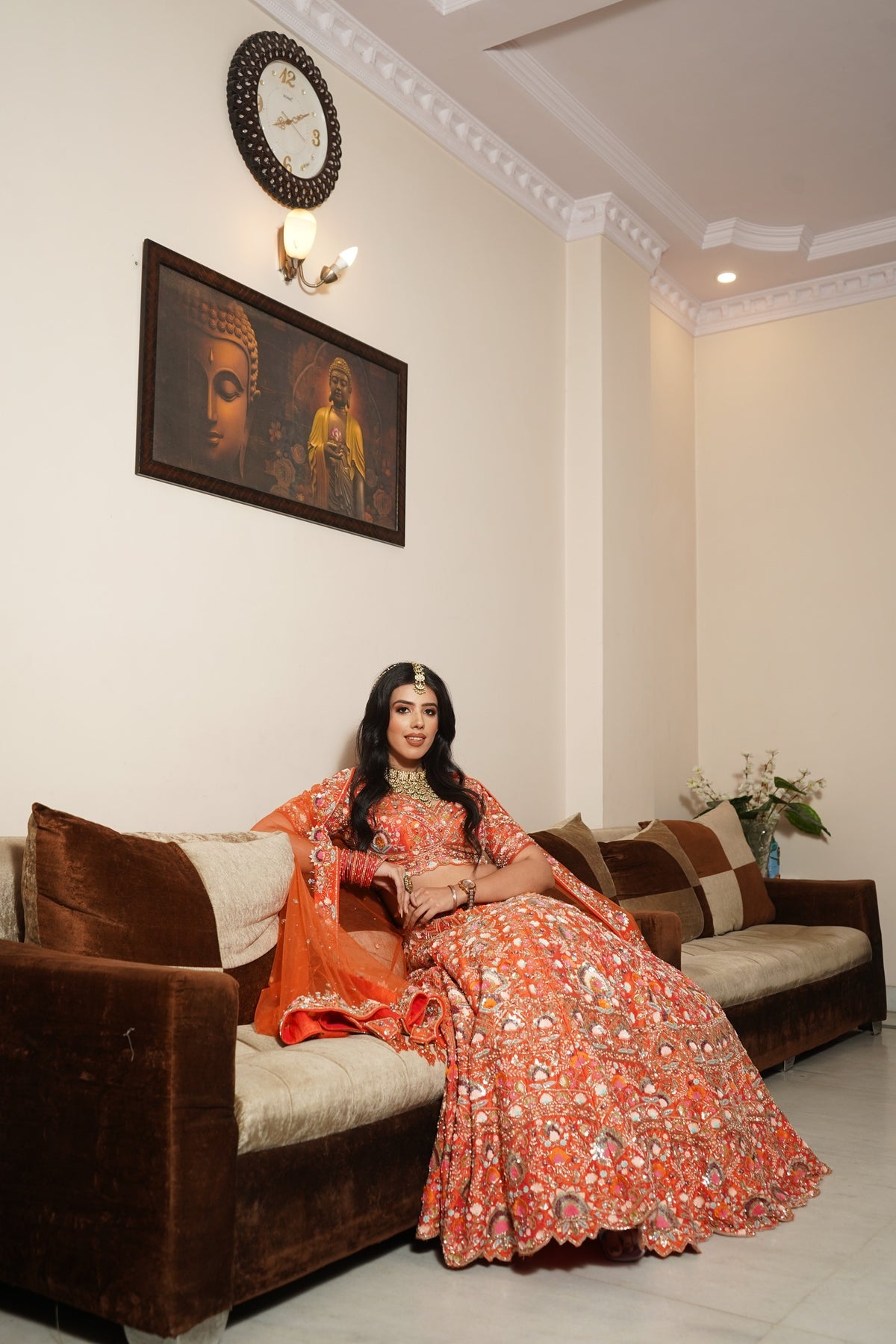 Classy orange color floral motif hand embroidered lehanga