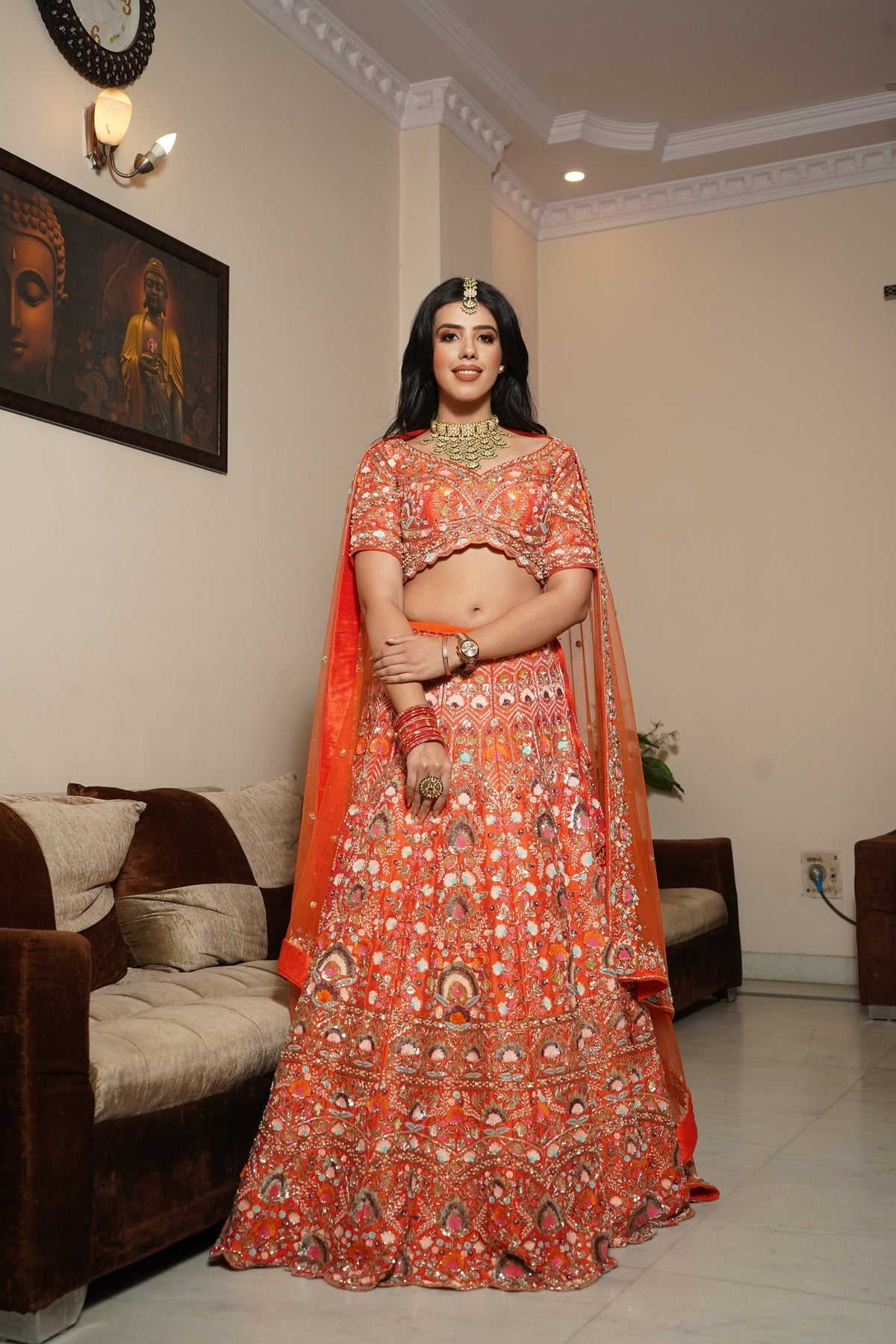 Classy orange color floral motif hand embroidered lehanga