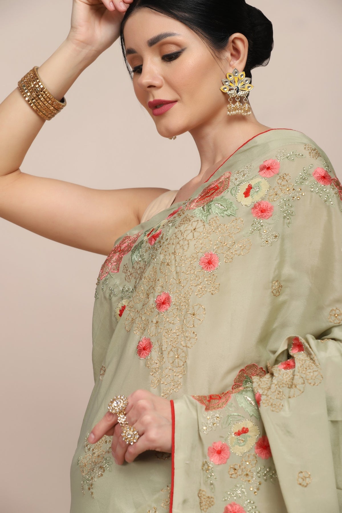Adorable green color floral motif embroidered saree