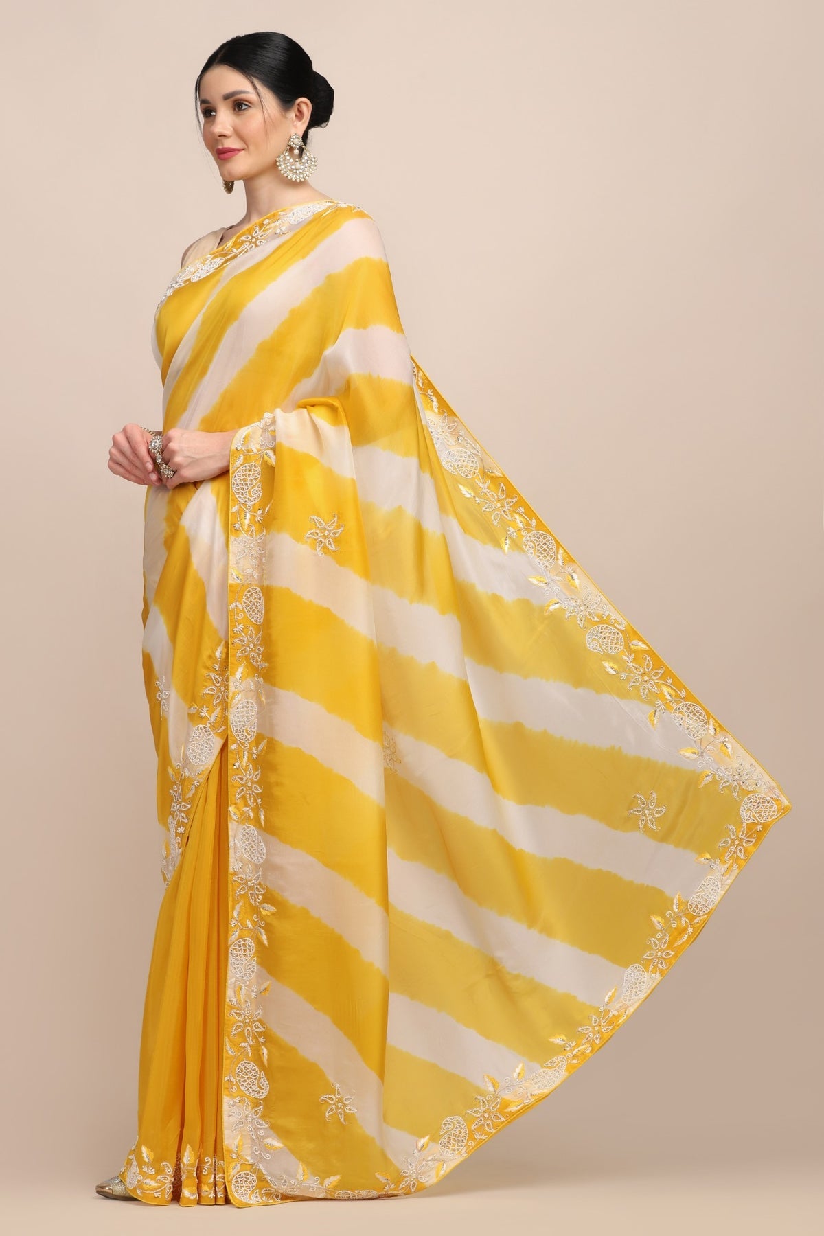 Elegant yellow color tie and dye embroidered saree
