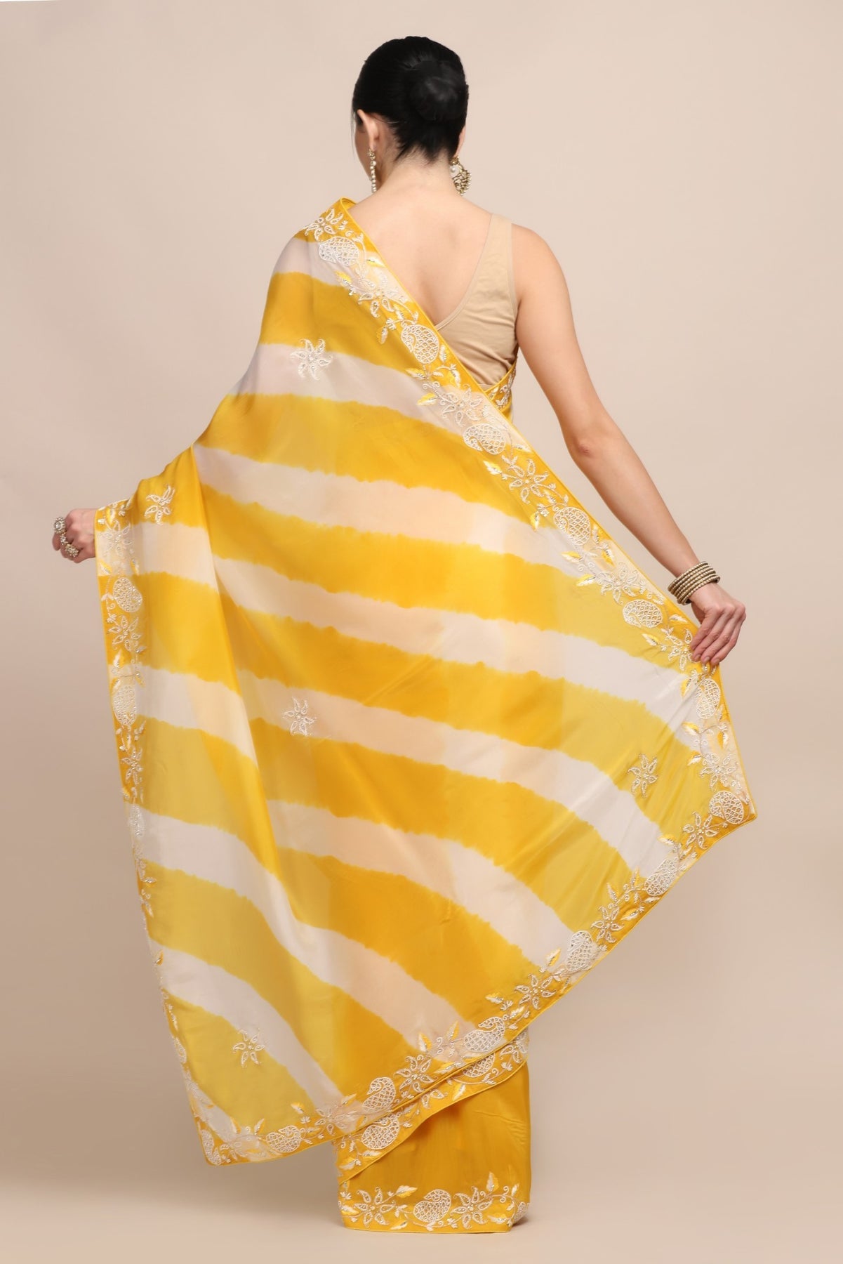 Elegant yellow color tie and dye embroidered saree
