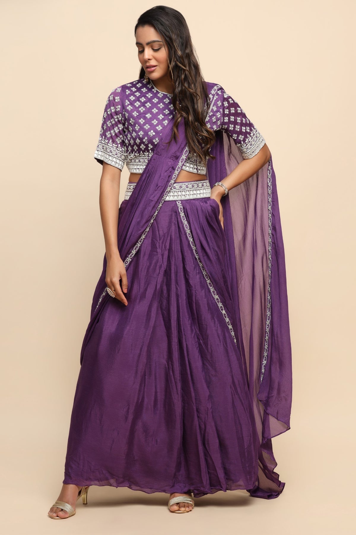 Elegant purple color floral motif embroidered skirt with draped saree