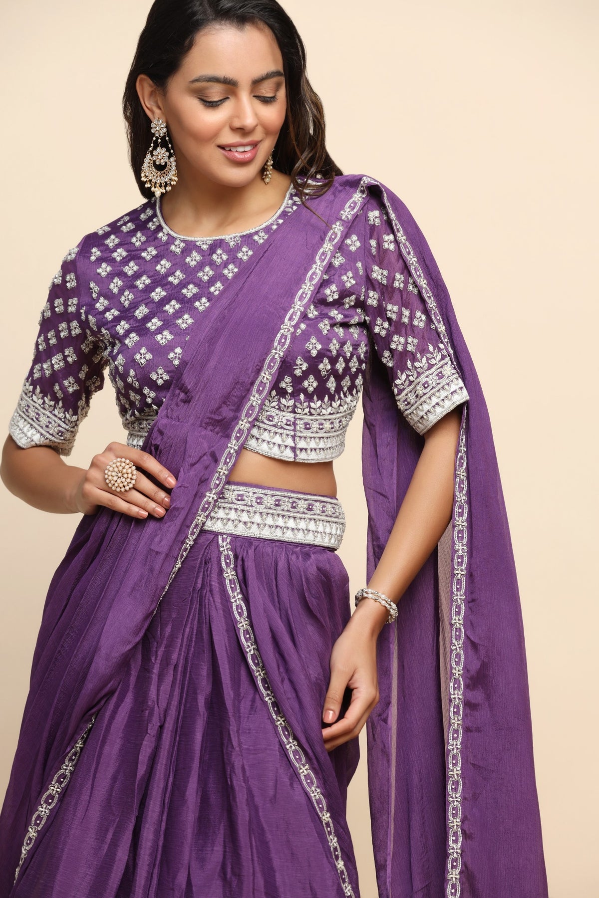 Elegant purple color floral motif embroidered skirt with draped saree