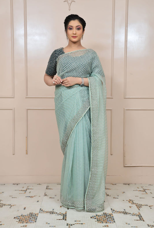 Classy aqua color geometrical motif embroidered saree