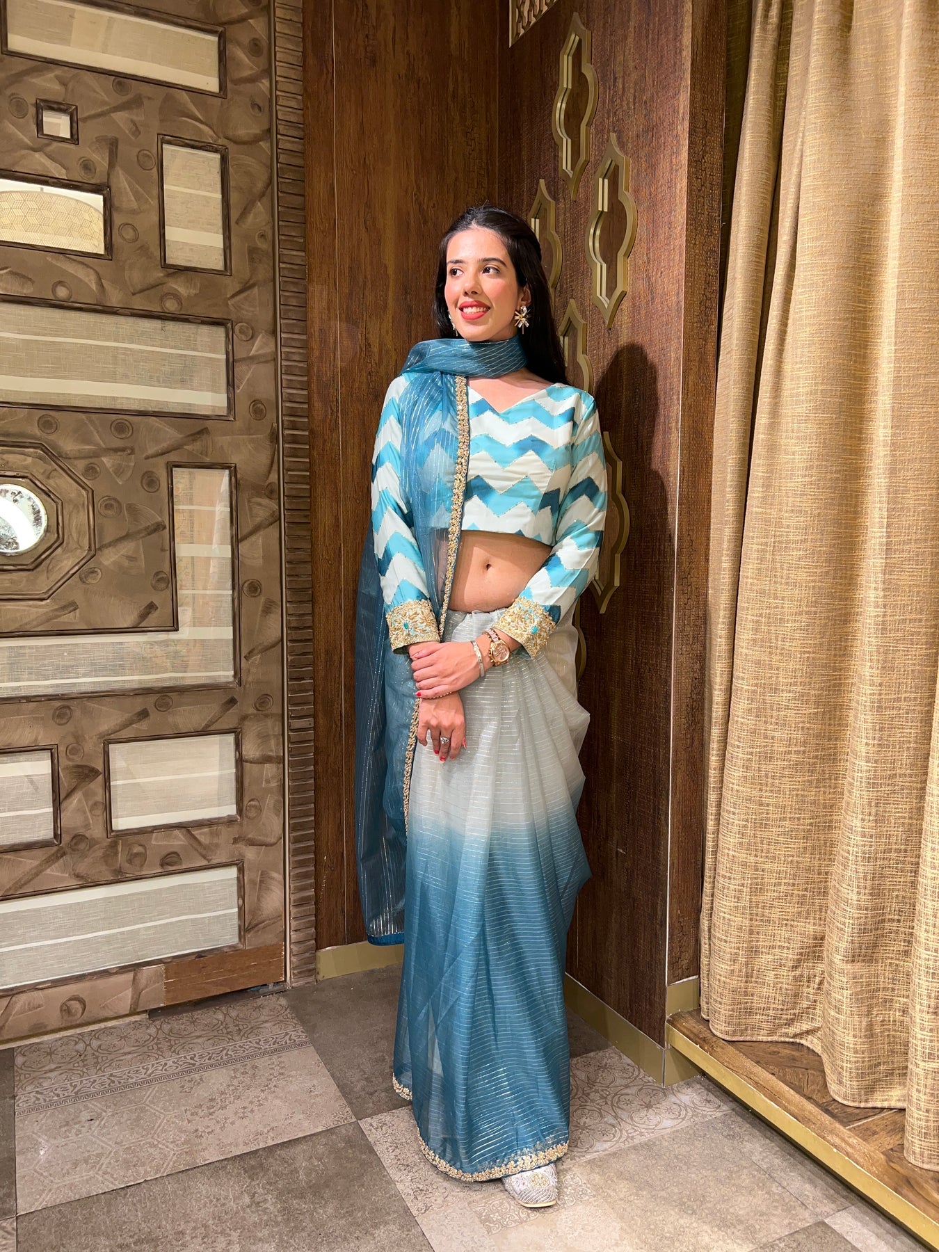 elegant blue color floral motif saree