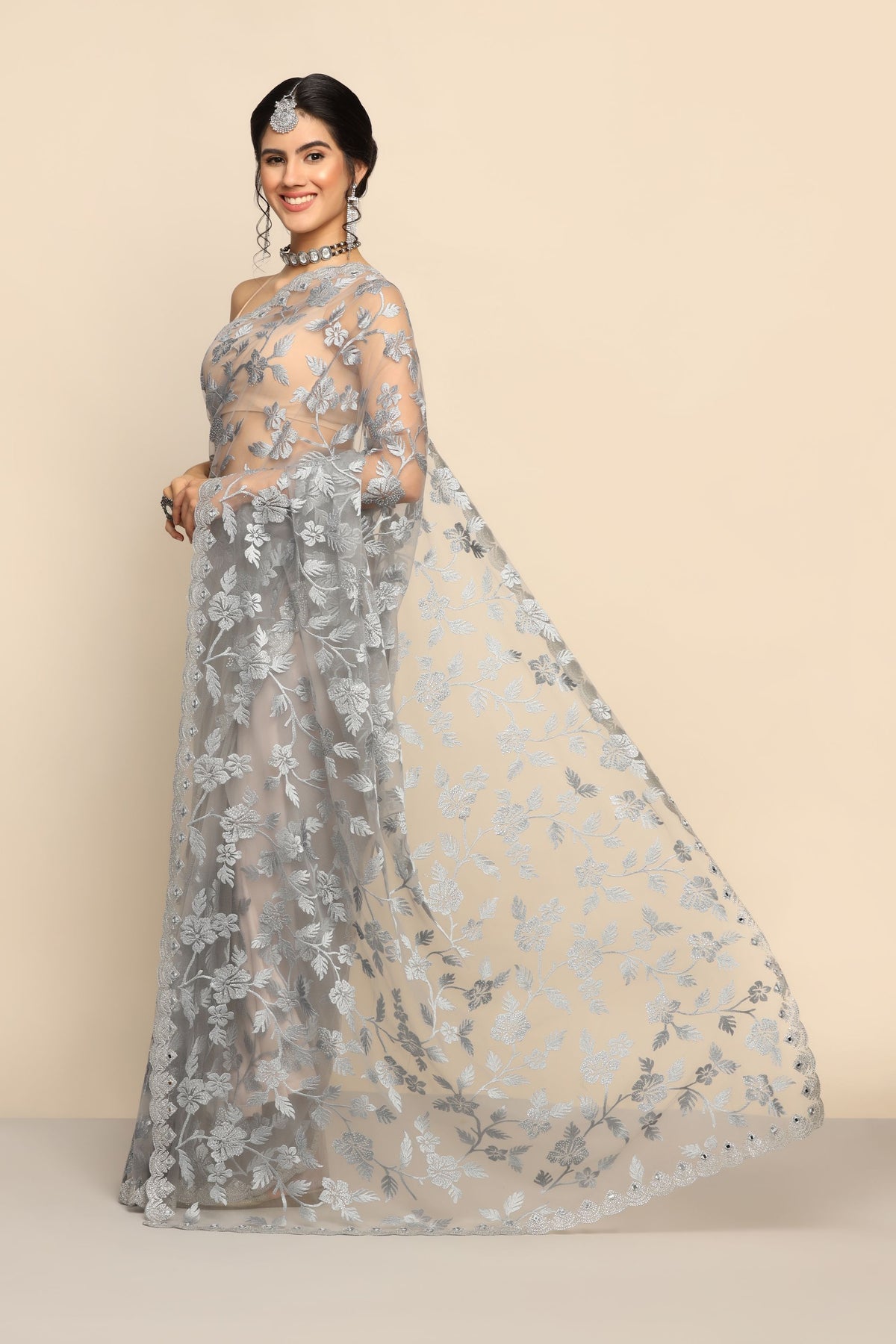 Graceful Grey Net Saree with Intricate Thread Work and Sparkling Sequins