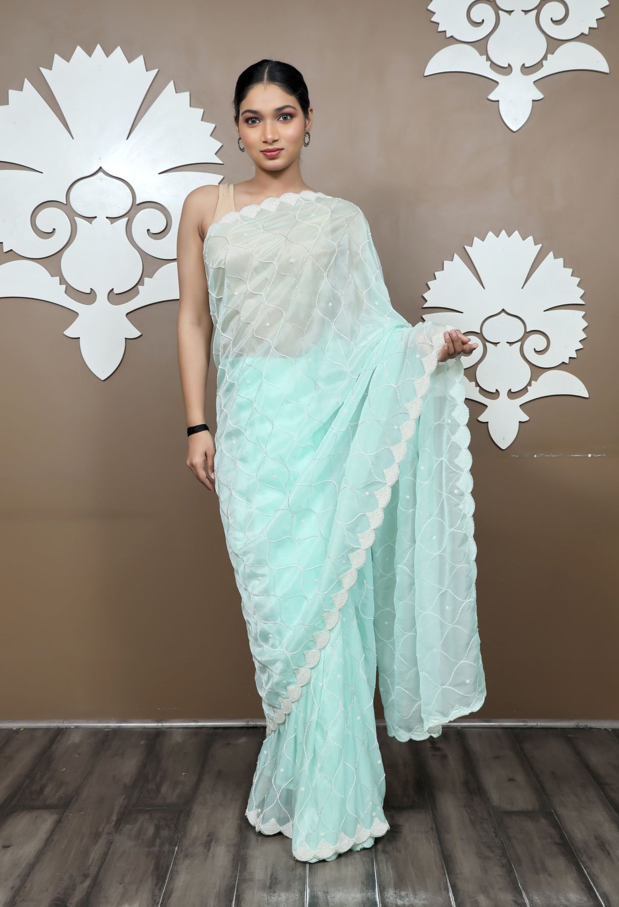 Elegant Aqua Color Geometrical Motif Embroidered Saree